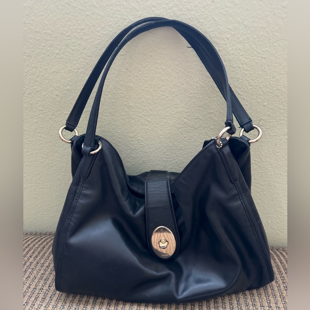 Coach black leather purse good condition no rips or tears.